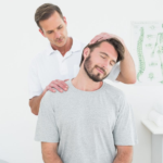 Chiropractor gently adjusting a patient's neck