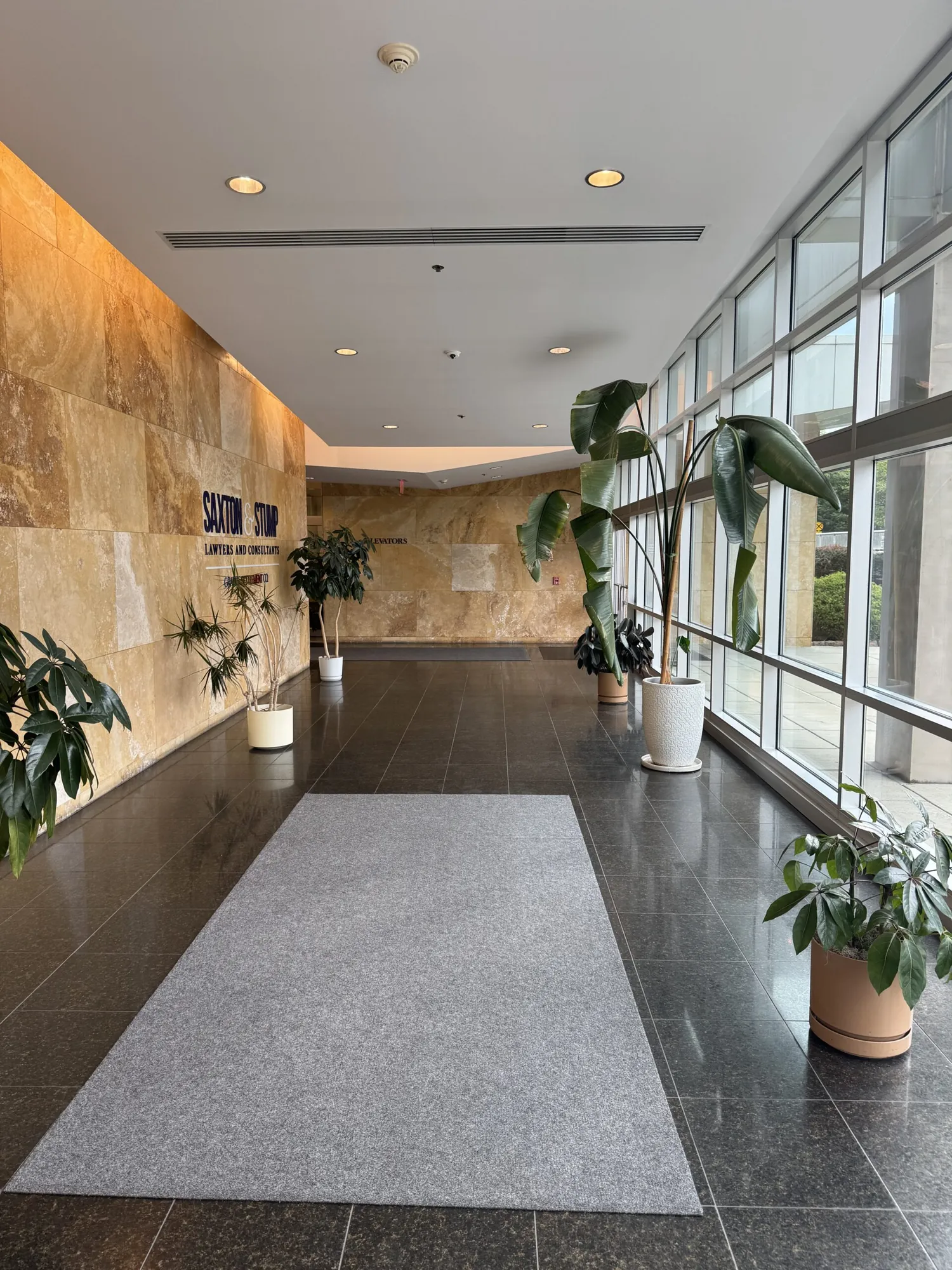 Lobby entrance with stone walls and plants at the Harcourt Brain Center building in York, PA